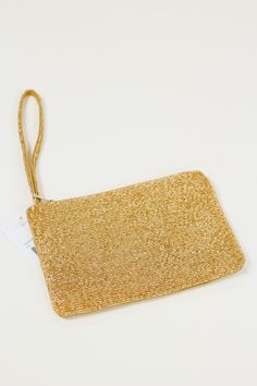 Make waves with this gold beaded wristlet! Rock 'n roll right-on to your next event with this eye-catching accessory that'll have you standing out in any crowd. It's sure to be a conversation starter and keep you looking sharp. (So, go ahead and show 'em who's boss!) Trendy Gold Beaded Bracelets For Party, Adjustable Wrist Strap Wristlet For Party, Adjustable Wristlet With Wrist Strap For Party, Gold Beaded Bracelets For Evening, Gold Beaded Evening Bracelets, Party Wristlet With Wrist Strap, Gold Rectangular Wristlet For Gifts, Elegant Gold Wristlet For Evening, Gold Adjustable Wristlet For Party