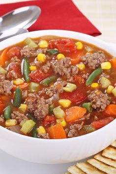 a white bowl filled with vegetable beef soup