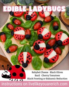 edible ladybugs are displayed on a wooden platter