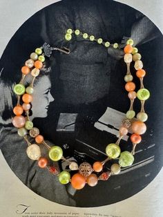 "50s 2-Strand Citrus with Variety of Beads Necklace. Very unique and beautiful with the variety of beads used.  Moon Glow round beads in Orange, taupy apricot, and  green, gold metal filagree beads, crackle lemon chiffon and crackle green irregular shaped beads , red-orange glass faceted round beads with gold filagree bead caps, dimpled pitted green irregular Lucite beads and in a couple different sizes. There are gold textured ornate bone shaped bead spacers. The maximum length is 20\" which includes the green pearlized extension chain. The shortest length is 17\" .It has pewter tone metal connectors on either side and a hook and extension chain on either end.  This in one of the most unique beaded pieces I seen with the interesting combo of beads and hardware. Love it! Free Shipping in t 50s Jewelry, Lemon Chiffon, Moon Glow, Necklace Vintage, Gold Texture, Bead Caps, Beads Necklace, Vintage Gifts, Green Gold