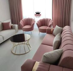 a living room filled with furniture and pink curtains