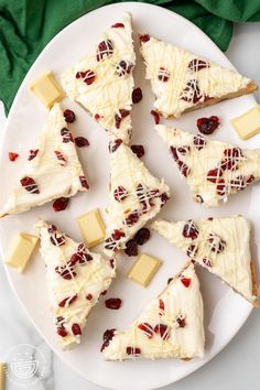 white chocolate and cranberry cheesecake slices on a plate