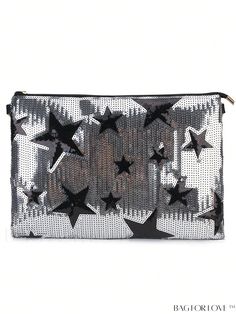 a black and white clutch bag with stars on the front, zippered in silver sequins