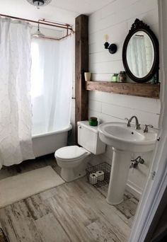 a bathroom with a sink, toilet and bathtub