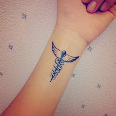 a woman's arm with a tattoo on it that says hope and an angel