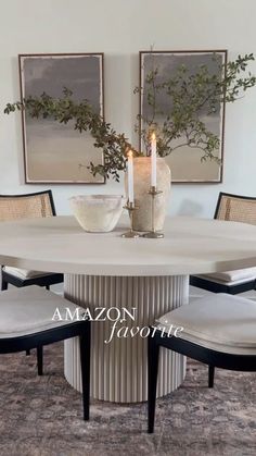 a dining room table with chairs around it