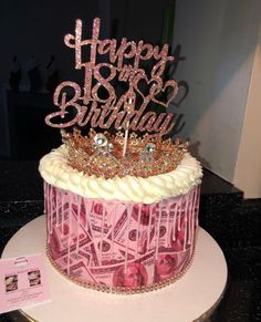 a birthday cake decorated with money and a tiara