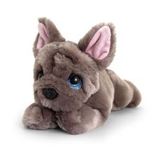 a stuffed dog with blue eyes laying down