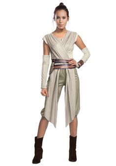 a woman in a star wars costume standing with her hands on her hips and looking at the camera