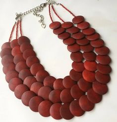 This red bib statement necklace is one of my favorites! All of the lovely, lightweight wooden coin beads are delicate, yet edgy. This one is a show-stopper!It's gorgeous for an evening out, a special event/occasions, or as a BOLD statement with your favorite outfit. Measurements: Approximately 17 inches long at the shortest strand with a 3 inch chain extender for easy length adjustment. Please message me for further length adjustments.Each piece of jewelry from my shop comes beautifully packaged Necklace Red, Chain Extenders, White Necklace, Valentine's Gift, Black Necklace, Blue Jewelry, Bib Necklace, Strand Necklace, My Favorites