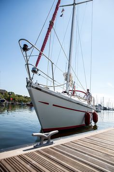 a sailboat is docked at the dock