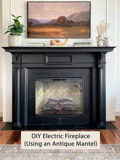 a fireplace with a painting above it and the words diy electric fireplace using an antique mantel