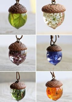 four different glass and wood ornaments hanging from strings