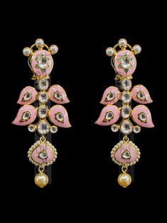 "Gulrukh Meenakari Bridal Set - Pink A pure hand-drawn detailed jewelry in the shades of soft pink and green meenakari work. This piece displays high-quality workmanship and fine usage of stones! This meenakari necklace set is perfect for western or traditional outfits. This set features a necklace with jadai detailing, featuring kundan chand motifs with lotus meenakari detailing. Delicate necklace accented with kundan stones and faux pearls creating a lush, sparkling set. The set includes a pai Temple Jewelry Kundan Chandbalis With Motifs, Traditional Chandbali Jhumkas For Designer Wear, Traditional Meenakari Chandbalis, Traditional Jhumkas For Designer Festivals, Traditional Meenakari Jhumkas For Designer Wear, Elegant Ceremonial Earrings With Motifs, Traditional Designer Chandbalis For Festivals, Designer Wear Festival Chandbalis, Designer Kundan Jhumkas With Meenakari