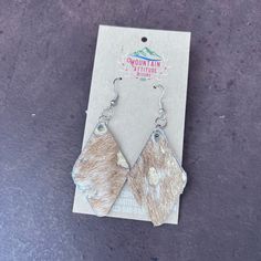 the earrings are made from cow hide