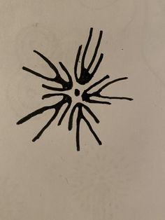 a black and white photo of an upside down design on a toilet paper with water droplets