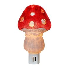 a red mushroom shaped night light on a white background