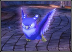 an animated blue bird with glowing wings on a brick walkway in front of a building