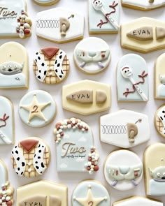 many decorated cookies are arranged on a table