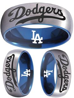 Los Angeles Dodgers Ring #losangeles #dodgers #la #dodgers #ladodgers #mlb #baseball #ring #mensring #new #weddingring #anniversary #gift #giftidea Los Angeles Dodgers Exclusive Ring – Own the Legacy, Wear the Victory! Calling all Dodgers fans—this is more than a ring, it’s your personal piece of baseball history! Whether you're watching the game from the stands or the comfort of your couch, this exclusive Los Angeles Dodgers ring makes every moment feel like a grand slam. Crafted with precision Silver Blue Wedding, Dodgers Gear, Mlb Dodgers, Baseball Ring, Blue Wedding Rings, Black Tungsten Wedding Band, Ring Logo, Tungsten Wedding Rings, Wedding Ring Sizes