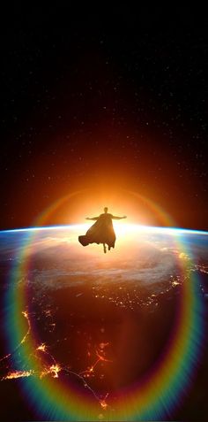 a person flying through the air with a rainbow in front of them and an earth background