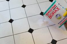 a person is cleaning the floor with a sponge and detergent on top of it