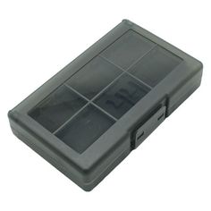 a gray plastic case with compartments for various items on the inside and outside of it