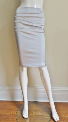 For Sale on 1stDibs - A gorgeous light grey stretch silk skirt from Dolce & Gabbana. It is a pencil style skirt with horizontal ruching across the front and back. There is functional Style Skirt, A Pencil, Silk Skirt, Skirt Fashion, Light Grey, Dolce And Gabbana, Pencil, Lace Up, Silk