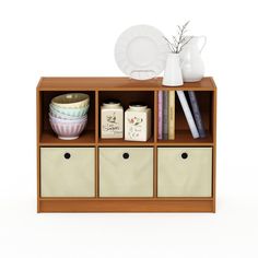 a wooden shelf with several containers and plates on it, next to a white vase