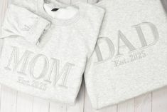 Please add kid names color of sweatshirt and color of thread in the note section  If you are local and can pick up your order from a business Niagara falls (weekend only) Enter code FREELOCALPICKUP DAD SWEATSHIRT, Dad Gift, Embroidered Dad Crewneck Kids Names Sweatshirt Pregnancy Reveal Gift for New dad Custom Shirt Father's Day Gift Mama sweatshirt Mom sweatshirt Mama gift Mother day gifts Mama Christmas gifts  DESCRIPTION Gildan 18000 Heavyweight Blend Crewneck Sweatshirt Nothing beats a high Family Cotton Crew Neck Sweatshirt, Family Matching Cotton Sweatshirt With Custom Text, Family Matching Custom Text Sweatshirt, Personalized Cotton Sweatshirt For Family, Personalized Cotton Family Sweatshirt, Dad Crewneck Sweatshirt, Father's Day Name Print Crew Neck T-shirt, Girls White Shirt, Customizable Crew Neck T-shirt For Father's Day