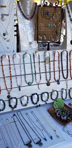 many necklaces are on display in a store