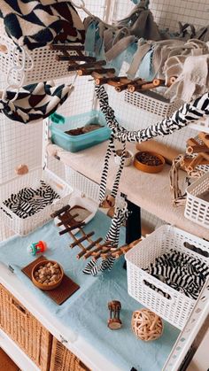 several baskets are stacked on top of each other in front of a mirror that is hanging from the ceiling