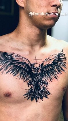 a man with a large black bird tattoo on his chest