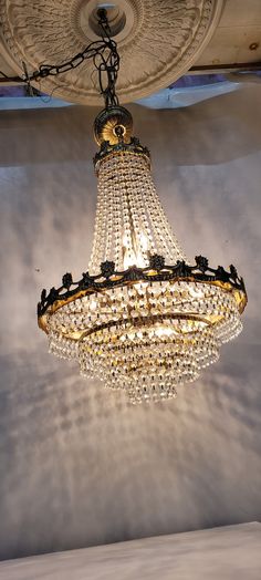 a chandelier hanging from the ceiling in a room