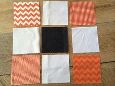 several different patterns are laid out on top of each other, including orange and white chevrons