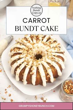 a bundt cake with white icing sitting on a plate next to other desserts