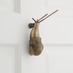 a metal object hanging from the side of a door