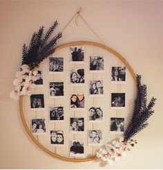 a circular frame with pictures and flowers hanging on the wall