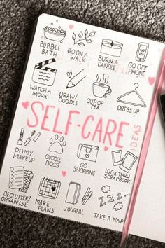 a notepad with writing on it that says self - care next to a cell phone