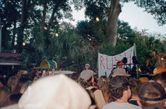 a group of people standing in front of a stage