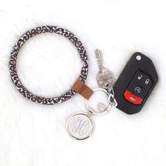 Convenience meets cute with this monogrammed key ring! Available in brown and in leopard, the brown metal key ring is laced through the middle of a duck boot cord so that it matches your monogrammed duck boots! This monogrammed key chain fits around your wrist easily, making it the perfect accessory to make keeping track of your keys cute and easy. Measuring 4 inches in diameter, this ring features a silver 1.375 inch silver disc for your monogram. Duck Boot, Marley Lilly, Duck Boots, Key Ring, Key Rings, Accessories Shop, Faux Fur, Track, Monogram