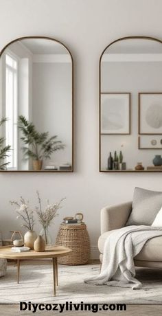 a living room with two mirrors on the wall and a couch in front of it