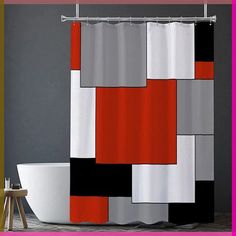 a bathroom with a bathtub, toilet and shower curtain that has different colored squares on it