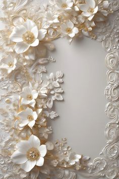 an ornate white and gold frame with flowers on it