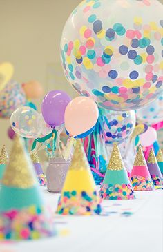 balloons and confetti are on the table