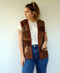 "Vintage leather suede patchwork vest in shades of brown, one pocket, Appliqué on the side - right lower panel in leaves and flower with some metallic color gold and bronze, fully lined, no closure. aside from minor signs of wear, good vintage condition. Approximate size: M-- tag reads size S- please refer to the measurements. M E A S U R E M E N T S -were taken with garments laying flat, please double where necessary. ------------------------♥-------- Bust/ Armpit to Armpit: 21\"- 53 cm Length: Brown Patchwork Vest For Fall, Fitted Sleeveless Hippie Vest, Vest Patchwork Vintage, Cheap Vintage Brown Vest, Brown Tailored Vintage Vest, Patchwork Outfit, Suede Patchwork, Vintage Brown Vest With Button Closure, Patchwork Vest