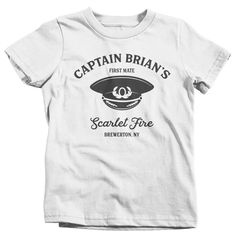 "Kids Personalized Captain T Shirt Boat Custom Boater Shirt Boat Uniform Captain Hat Sailor Shirt Nautical T-Shirt This personalized captain t shirt makes a great gift. Personalized with your title (captain Brian) boat name (Scarlet Fire) and location (Brewerton, NY), we can tailor this to suit any position of the boat crew! Great for a boat with a single member or a multi member crew that would include first mate, chef, etc. Makes great matching shirts for grandpa/grandson, father son, family b Navy Sailor Crew Neck Top, Nautical Short Sleeve Cotton Tops, Sailor Style Short Sleeve Cotton Top, Nautical Cotton Crew Neck Top, Cotton Nautical Crew Neck Tops, Sailor Style Cotton Crew Neck Top, Nautical White Crew Neck T-shirt, White Nautical Crew Neck T-shirt, Nautical White T-shirt With Graphic Print