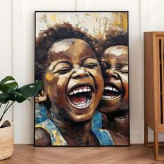 two children laughing with their mouths open in front of a painting on the wall next to a potted plant