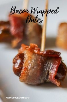 bacon wrapped dates on a white plate with toothpicks in the foreground and text overlay