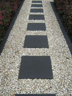 a walkway made out of stones and gravel